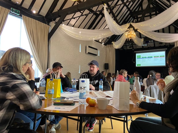 People sitting around table at CAPITAL drug and alcohol partnership event 1